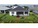 Aerial view of fenced backyard with trampoline and playset, perfect for outdoor fun at 13708 Old Creek Ct, Parrish, FL 34219