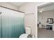 This bathroom features a toilet, shower, and a curtain with an ombre design at 13708 Old Creek Ct, Parrish, FL 34219