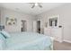 Relaxing bedroom features a white dresser with a mirror and an ensuite bathroom at 13708 Old Creek Ct, Parrish, FL 34219