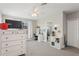 Bright bedroom featuring a desk, storage, ensuite, and a comfortable layout at 13708 Old Creek Ct, Parrish, FL 34219