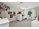 Cozy bedroom featuring neutral walls, plush carpet, ceiling fan, and fun movie-themed decor at 13708 Old Creek Ct, Parrish, FL 34219