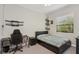 This bedroom offers a ceiling fan, a window, and desk space at 13708 Old Creek Ct, Parrish, FL 34219