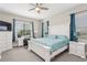 Bedroom features a bed, desk, and dresser set, providing a comfortable and functional space at 13708 Old Creek Ct, Parrish, FL 34219