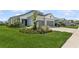 Attractive home showcasing lush green lawn, meticulous landscaping, and a convenient two-car garage at 13708 Old Creek Ct, Parrish, FL 34219