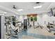 Well-equipped gym featuring weight machines, free weights, and large mirrors at 13708 Old Creek Ct, Parrish, FL 34219