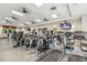 Modern gym equipped with treadmills, elliptical machines, and weightlifting equipment at 13708 Old Creek Ct, Parrish, FL 34219