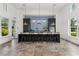 Clubhouse kitchen featuring tile backsplash, modern appliances, an island with seating, and decorative pendant lights at 13708 Old Creek Ct, Parrish, FL 34219