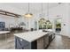 Spacious kitchen with large island, stainless steel appliances and open floorplan at 13708 Old Creek Ct, Parrish, FL 34219