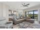 Spacious living room seamlessly connected to the kitchen and patio, creating an open concept perfect for entertaining at 13708 Old Creek Ct, Parrish, FL 34219
