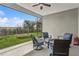 Screened patio featuring comfortable seating and an outdoor view of the backyard with playset at 13708 Old Creek Ct, Parrish, FL 34219
