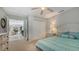 Bedroom boasts a walk-in closet, an adjoining sitting room and light green paint at 1461 Porpoise Rd, Venice, FL 34293