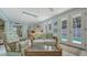 Living room with wicker seating, decorative pillows and a view of the outdoors at 1461 Porpoise Rd, Venice, FL 34293