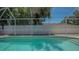 Sparkling pool enclosed with screened in patio to enjoy outdoor swims with privacy at 1461 Porpoise Rd, Venice, FL 34293
