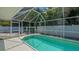 Inviting pool area enclosed by a screened lanai, offering a serene and private swimming experience at 1461 Porpoise Rd, Venice, FL 34293
