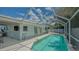 Refreshing pool with screened enclosure, seamlessly blending indoor and outdoor living for ultimate enjoyment at 1461 Porpoise Rd, Venice, FL 34293
