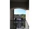 Private balcony offering views of covered parking and lush landscaping at 16904 Vardon Ter # 208, Lakewood Ranch, FL 34211