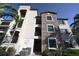 Mediterranean-style condo with stone accents, balconies, and well-maintained landscaping at 16904 Vardon Ter # 208, Lakewood Ranch, FL 34211