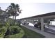 Convenient covered parking area surrounded by lush greenery and palm trees at 16904 Vardon Ter # 208, Lakewood Ranch, FL 34211