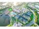 Overhead view of a Primary-planned community featuring the clubhouse, pool, and tennis courts at 18008 Waterville Pl, Bradenton, FL 34202