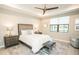 Bright bedroom with a king-sized bed, neutral colors, and a ceiling fan at 18008 Waterville Pl, Bradenton, FL 34202