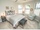 Cozy bedroom with natural light, decorative rug, comfortable seating, and neutral color palette at 18008 Waterville Pl, Bradenton, FL 34202