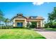 Inviting community entrance with well-maintained landscaping, decorative architecture, and a clear blue sky at 18008 Waterville Pl, Bradenton, FL 34202