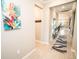 Long hallway with an eye-catching accent rug, leading into the home's inviting dining area at 18008 Waterville Pl, Bradenton, FL 34202