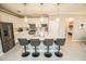 Bright kitchen featuring an island with seating, stainless steel appliances, and streamlined design at 18008 Waterville Pl, Bradenton, FL 34202