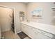 Laundry room with white cabinets and a clean, organized space at 18008 Waterville Pl, Bradenton, FL 34202