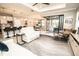 Open-concept living room flows to kitchen, featuring neutral decor and seamless access to the lanai at 18008 Waterville Pl, Bradenton, FL 34202