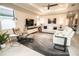 Bright living room with a ceiling fan, a large television, and modern furniture at 18008 Waterville Pl, Bradenton, FL 34202