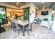 Stylish covered patio features a dining area and comfortable seating for relaxing outdoors at 18008 Waterville Pl, Bradenton, FL 34202