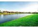 A community pond surrounded by well-manicured lawns and attractive landscaping at 18008 Waterville Pl, Bradenton, FL 34202