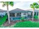 A relaxing private pool area with screened-in lanai and lush tropical landscaping in the backyard at 18008 Waterville Pl, Bradenton, FL 34202