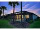 A relaxing private pool area with screened-in lanai and lush tropical landscaping in the backyard at 18008 Waterville Pl, Bradenton, FL 34202