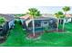 A relaxing private pool area with screened-in lanai and lush tropical landscaping in the backyard at 18008 Waterville Pl, Bradenton, FL 34202