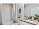 Bright bathroom with a shower-tub combination and a modern vanity with chrome fixtures at 18212 Wheathouse Pl, Lakewood Ranch, FL 34211