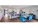 Open-concept kitchen and dining area with stylish furnishings and plenty of natural light at 18212 Wheathouse Pl, Lakewood Ranch, FL 34211
