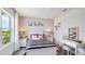 Stylish bedroom featuring black and white striped bedding, vanity table, and bright natural light at 18227 Canopy Pl, Lakewood Ranch, FL 34211