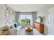 Cozy living room with stylish wall decor and a serene view at 18227 Canopy Pl, Lakewood Ranch, FL 34211