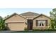 Charming single-story home featuring a two-car garage, stone accents, and manicured front lawn at 18305 Canopy Pl, Lakewood Ranch, FL 34211