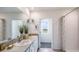 Bright bathroom with double vanity, modern fixtures and a separate shower area at 18313 Canopy Pl, Lakewood Ranch, FL 34211