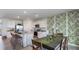 Bright kitchen with stainless steel appliances, central island and elegant dining area at 18313 Canopy Pl, Lakewood Ranch, FL 34211