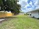 Lush, fenced backyard offering plenty of green space and privacy at 1902 24Th W Ave, Bradenton, FL 34205