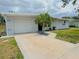 Well-maintained home with a tidy front yard and a driveway leading to an attached garage at 1902 24Th W Ave, Bradenton, FL 34205