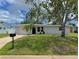 Charming single-story home features a well-manicured lawn and a classic mailbox at 1902 24Th W Ave, Bradenton, FL 34205