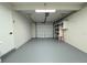Clean, spacious garage with epoxy flooring, garage door, and built-in storage cabinets at 1902 24Th W Ave, Bradenton, FL 34205