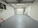 Spacious garage features clean walls, utility sink, and ample storage space at 1902 24Th W Ave, Bradenton, FL 34205