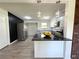Stylish kitchen with white cabinetry, granite countertops, stainless steel appliances, and decorative pendant lighting over the island at 1902 24Th W Ave, Bradenton, FL 34205