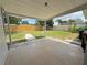 Relaxing covered patio with tile flooring overlooking the fenced backyard at 1902 24Th W Ave, Bradenton, FL 34205